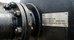 Flange and nameplate details of a high-pressure industrial softener tank.